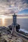 France-Brittany-Le Conquet Sun setting at the Kermorvan Lighthouse Art Print